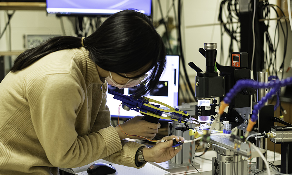 A student working on a project in a lab.