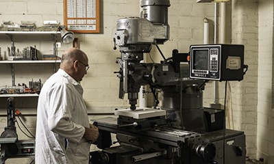 Jeff Lefler at the CNC mill.