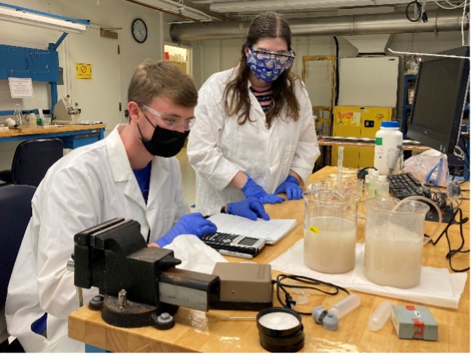 Two students working in the lab.
