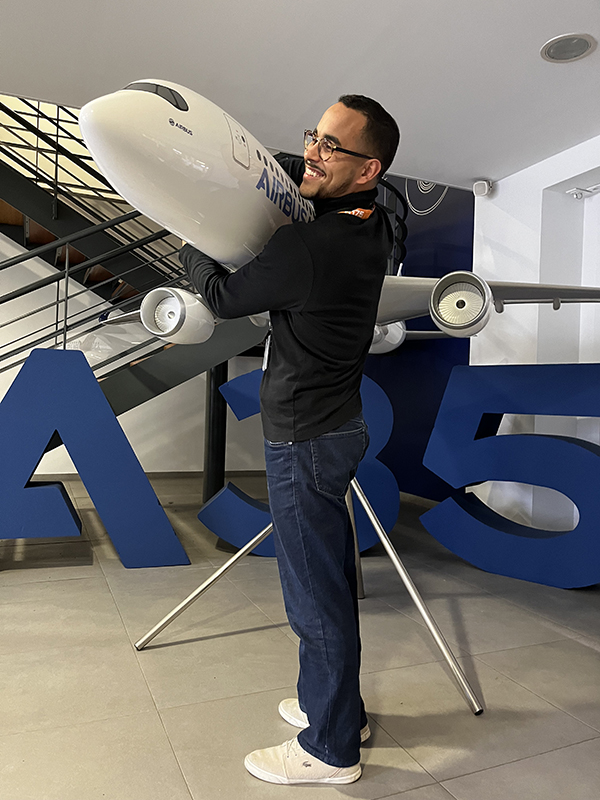 Marcos hugging a model airbus.