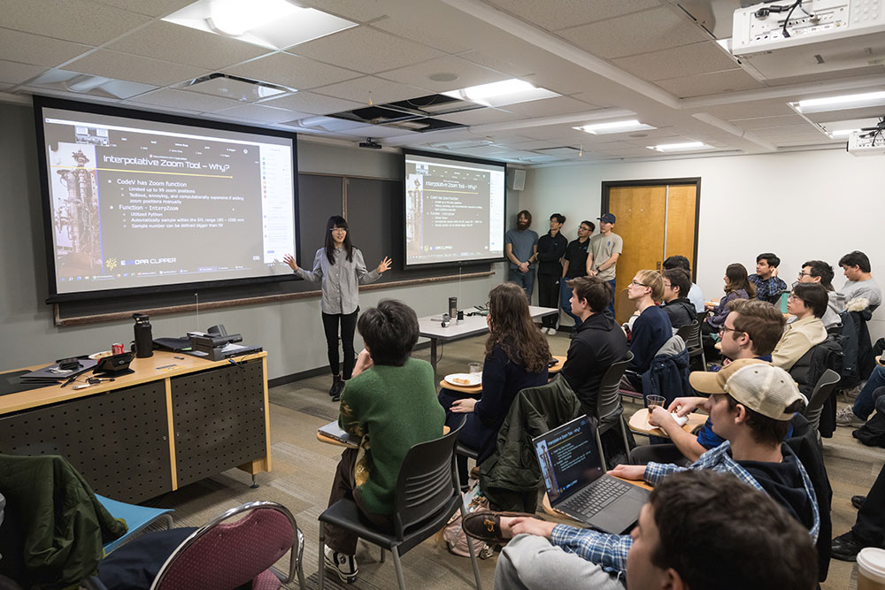 A student leads a group presentation in class.