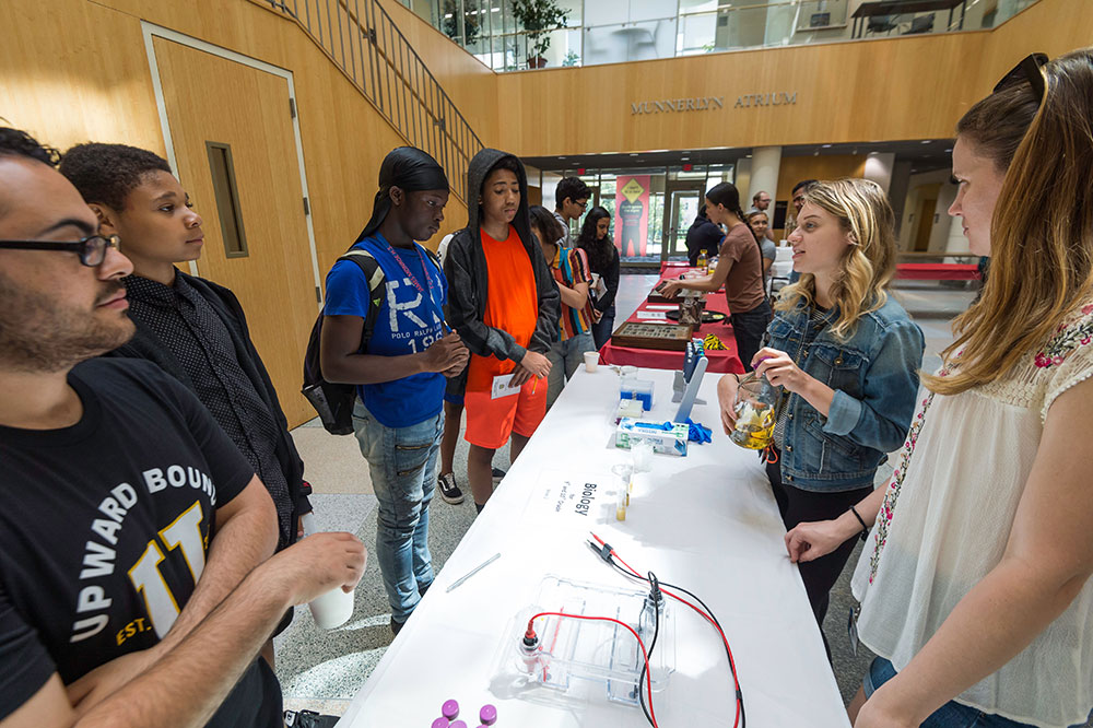 A group of young people attending an activities fair.