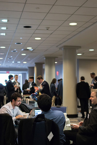 Students networking during the spring 2022 symposium.