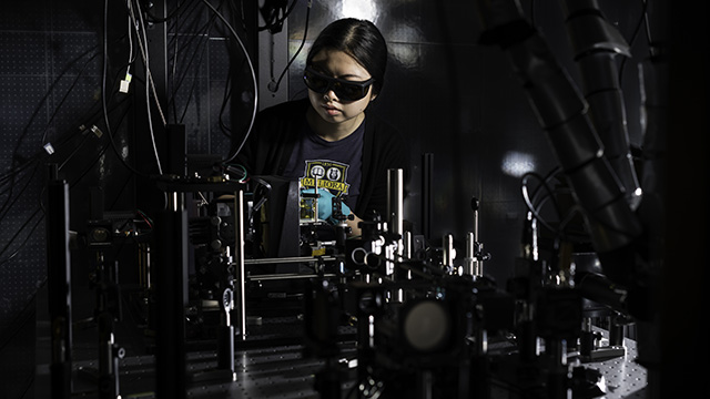 A student a freeform optical metrology setup in a lab.