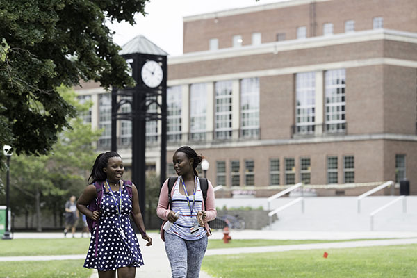 Two students walking together on campus.