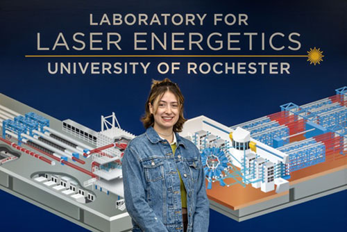 A headshot of Julia pasted onto a graphic illustration of the laser lab.