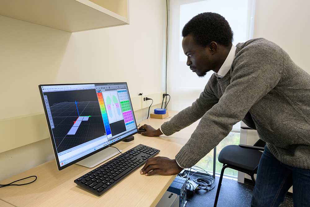 A student using a computer to analyze data.