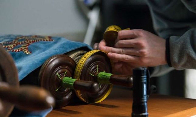 torah scroll on wooden roller