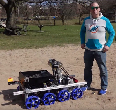 Person looking at camera with ground robot device