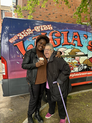 Velma hugging Barb in front of ice cream truck