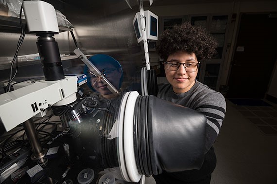 Tara Pena posing with lab equipment