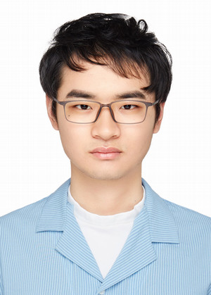 Headshot of Ge Zhu looking at camera wearing blue polot shirt