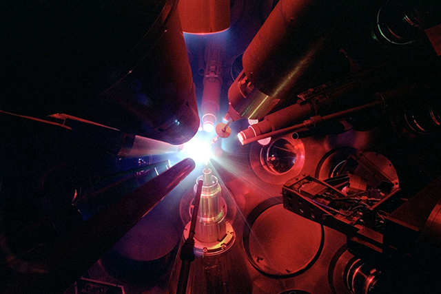 Multiple pieces of equipment pointed at a beam of white.
