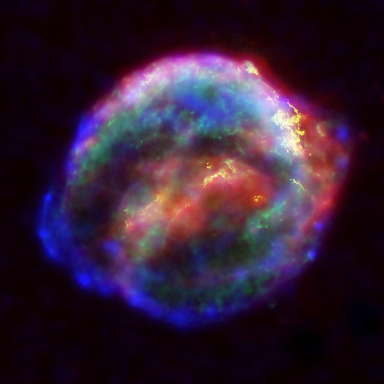 A cloudy, multi-colored sphere on a black background.