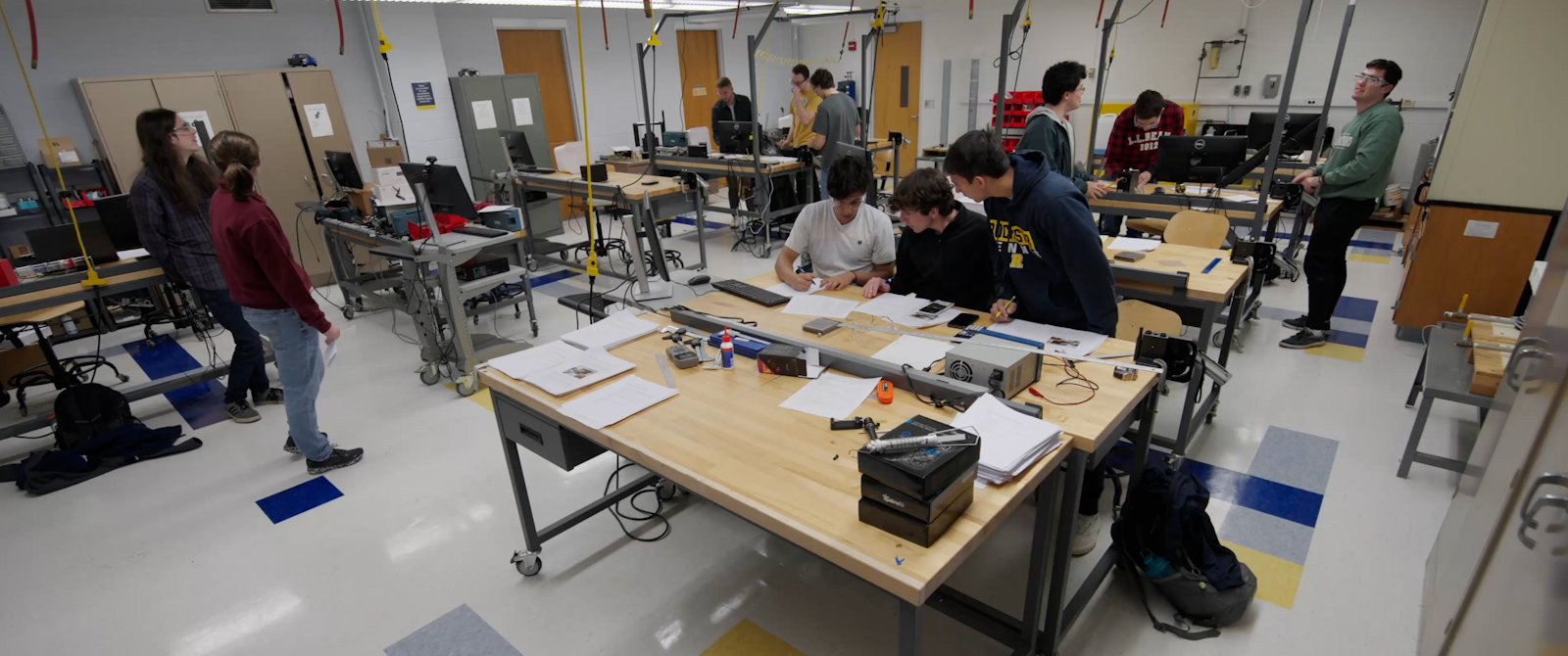 Students work in small groups in a mechanical engineering lab.