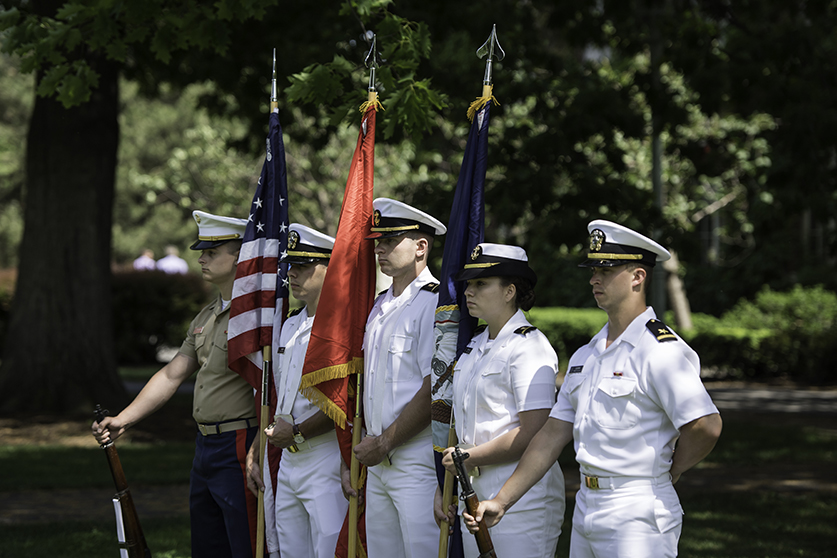 NROTC Honor Guard presents colors during a ceremonyy.