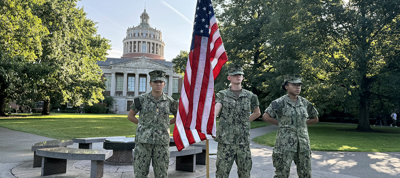 NROTC members standing vigil on the Eastman Quad in front of Rush Rhees Library.