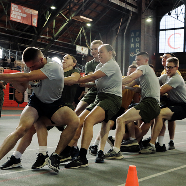 A group of midshipman engaging in a tug of war.