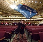 Waving the Institute flag at commencement 2016