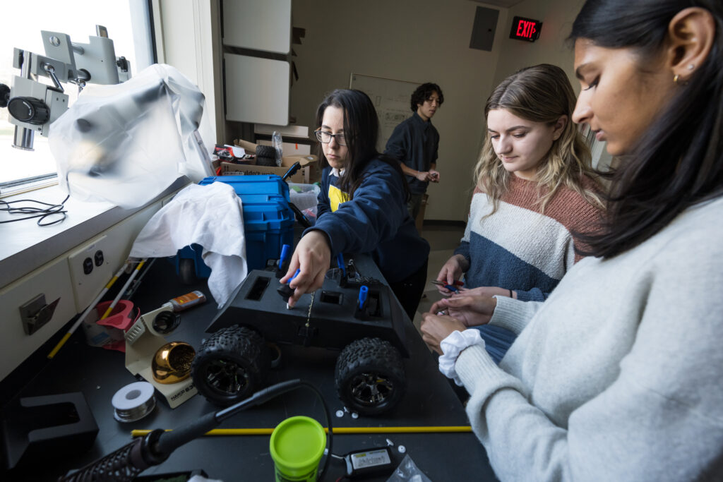 BME seniors l-r: Rachelle Gomez-Guevara, Lawrence Chen, Sarah Manning and Anjali Patel work on their senior design project, a tick collection system for use in Costa Rica, in Goergen Hall